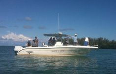 several people on a small boat in the water