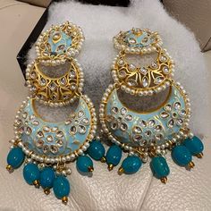 Height: 3.5” Type: Kundan Earrings Color: Light Blue (Just Like Photos) Blue Danglers For Party, Blue Chandbali Bridal Earrings, Blue Elegant Handmade Danglers, Handmade Blue Elegant Danglers, Blue Festive Danglers, Blue Drop Danglers For Festive Occasions, Blue Chandbali Chandelier Earrings For Party, Traditional Blue Chandelier Earrings For Party, Traditional Blue Danglers