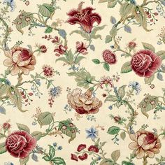 a flowered fabric with red and green flowers on it