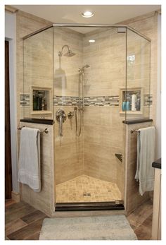 a walk in shower sitting inside of a bathroom