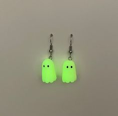 These friendly lil ghosties want nothing more than to be your new friend! Charge them up with a bright light and they glow! Hand sculpted with polymer clay and featuring stainless steel for sensitive ears. Note that the product may vary slightly from photos, as each pair is handmade Dark Ghost, Ghost Earrings, Handcrafted Accessories, Bright Light, Sensitive Ears, In The Dark, Glow In The Dark, Jewelry Earrings Dangle, Polymer Clay