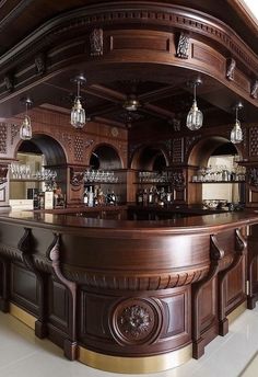 a large wooden bar with lots of bottles on it