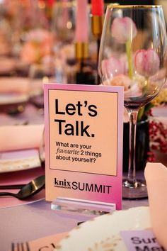 a table with a sign that says let's talk what are your favorite things about yourself?