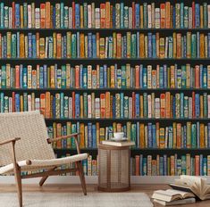 a chair in front of a bookshelf filled with lots of different colored books