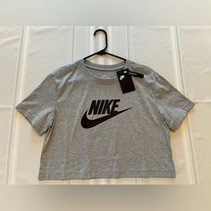 Nike Tshirt Xs Brand New With Tags Crop Style Smoke / Pet Free Home Basic Logo Print Top For Spring, Basic Spring Top With Logo Print, Nike Gray Tops With Letter Print, Nike Basic Tops For Streetwear, Basic Nike Crew Neck Top, Nike Athleisure T-shirt For Spring, Nike Spring Athleisure T-shirt, Basic Nike Tops For Streetwear, Casual Nike Short Sleeve Tops