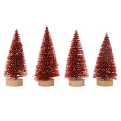 three small red christmas trees on wooden bases