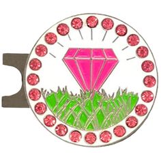 a pink and green diamond shaped broochle with grass in the center, surrounded by red stones