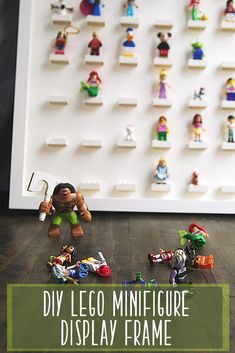 lego minifigure display frame with toy figures on the wall and text overlay that reads diy lego minifigure display frame