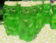 there are many green teddy bears in the bottles