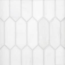 a white tile wall with hexagonal shapes