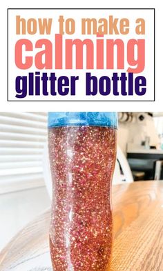 a bottle filled with glitter sitting on top of a wooden table next to the words how to make a calming glitter bottle