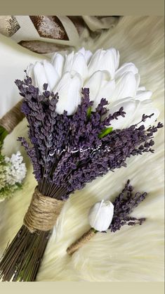 white and purple flowers are tied to the fur