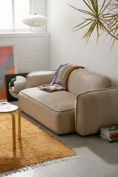 a living room filled with furniture and a rug