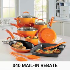 an orange cookware set on a white counter top with the words $ 40 mail - in rebate