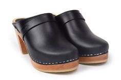 Our popular Stockholm clogs in a smooth black pull up leather that will age with beautiful patina. The clogs are made on a varnished high heel wooden base which makes them great companions for most seasons.Heel height: 8.5 cmPlatform height: 2.5 cmFit: Narrow to medium widthLeather Upper: Portugese black pull upWood: Varnished alderwoodFootbed: Natural alderwood for excellent moist absorption*Maguba Size Guide*EUR 35 | USA 5-5.5 (227mm | 8.94 inches)EUR 36 | USA 6-6.5 (233mm | 9.17 inches)EUR 37 High Heel Clogs, Swedish Clogs, Black Clogs, Leather Clog, Boho Sandals, High Heel Mules, Tan Sandals, Wooden Clogs, Clog Heels