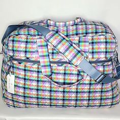 New! Large Roomy Travel Bag With Versatile Shoulder And Top Handle Carrying Straps With 6" Drop. Front Features Large Zip Pocket. Large Zippered Main Compartment With Four Interior Mesh Pockets. Back Features Three Slip Pockets. Brand: Vera Bradley Pattern: Gingham Plaid Measurements: 21"L X 14.25"H X 8.5"W Posh Ambassador Top Rated Seller Fast Shipper Reasonable Offers Accepted Rectangular Purple School Travel Bag, Rectangular Purple Duffle Bag, Rectangular Purple Travel Bag For On-the-go, Multicolor Rectangular Bag For Weekend, Multicolor Rectangular Bags For Weekend, Rectangular Purple Duffle Bag For Everyday Use, Purple Travel Bag With Adjustable Handle, Everyday Purple Rectangular Travel Bag, Gingham Travel Tote Bag