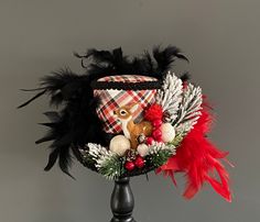 a hat with feathers and other decorations on it