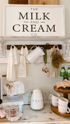 the milk and cream co sign is hanging on the wall above an old kitchen counter