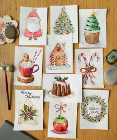 several christmas cards are laid out on a table