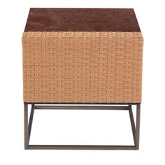 a wicker stool with brown leather top and metal legs on an isolated white background