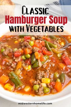 a bowl of hamburger vegetable soup with a spoon in it and the title overlay reads