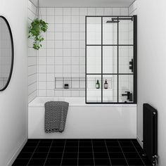 a black and white tiled bathroom with a plant in the corner, mirror on the wall