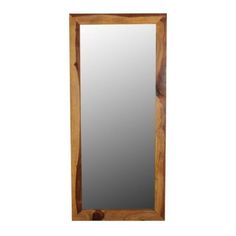 a wooden mirror hanging on the wall