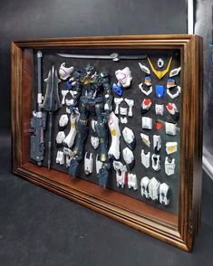 a framed shadow box with action figures on it