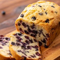 a loaf of blueberry bread on a cutting board