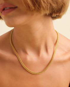 Try the 5mm Cuban Link Chain in gold for a radiant glow. An everyday essential that transitions seamlessly from day to night, this is the perfect piece to start your jewelry collection. Find out why this necklace is our best-seller. JAXXON 5mm Women's Cuban Link Gold Chain | 18"/20" Classic Everyday Cuban Link Necklace, Tarnish Resistant, Classic Cuban Link Necklace Tarnish Resistant For Everyday, Classic Round Chain Necklace For Everyday, Everyday Box Chain Necklace, Classic Everyday Box Chain Necklace, Minimalist Cuban Link Necklace With Box Chain For Everyday, Elegant Cuban Link Necklace With Adjustable Chain For Everyday, Everyday Minimalist Cuban Link Necklace With Box Chain, Elegant Everyday Cuban Link Necklace With Adjustable Chain