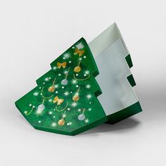 a green christmas tree shaped box with lights on it