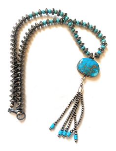 New without tags BRAND : Nizhoni Traders LLC ETHNIC & REGIONAL STYLE : Native American JEWELRY TYPE : Necklaces TYPE : Necklace COLOR : Blue PENDANT/LOCKET TYPE : Tassel STYLE : Beaded MAIN STONE COLOR : Blue METAL : Sterling Silver TRIBAL AFFILIATION : Navajo MAIN STONE : Turquoise Lovely Navajo Turquoise and Sterling Silver Pearl Beaded Tassel Necklace. Absolutely beautiful! Necklace measures 22 inches long. Tassel measures an additional 4 1/2 inches. Thank you for checking out our store! Plea Turquoise Jewelry With Tassels And Round Beads, Pendant Locket, Beaded Tassel Necklace, Navajo Turquoise, Blue Pendant, Pendant Rings, Beaded Tassels, American Jewelry, Native American Jewelry