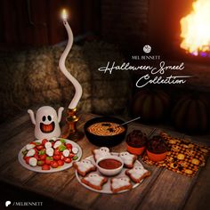 a table topped with halloween treats and marshmallows next to a fire place