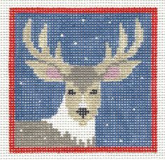 a cross stitch pattern of a deer with antlers on it's head, in front of a blue background