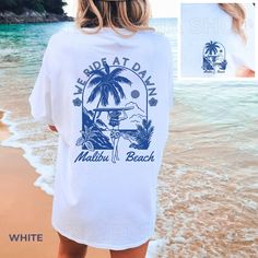 Coastal Cowgirl Malibu Shirt Trendy Beachy Shirt Coconut Girl Clothes Western Graphic Tees Salty Granola Girl Comfort Colors Plus Sizing - Etsy White Short Sleeve Surfing Shirt, Printed White Tops For Surfing, White Screen Print Tops For Vacation, White Screen Print Top For Vacation, White Summer Shirt For Beach Party, Beachy White Tops With Graphic Print, White Short Sleeve Beachy Tops, White Graphic Print Shirt For Beach Party, Beachy White Short Sleeve Tops