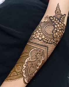 a woman's arm with hendix on it, and an intricate design