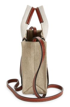 Chloé's classic logo stands out at the sturdy webbed straps of this scaled-down tote in linen canvas set off with topstitched leather accents. The style comes with a crossbody strap for the option of hands-free carry. 7.5"W x 5.5"H x 1.6"D Open top Top carry handles; removable, adjustable crossbody strap Interior wall pocket Linen with leather trim Made in Italy Designer Handbags Luxury Textured Leather Bags With Canvas Material, Luxury Canvas Bags With Textured Leather, Luxury Textured Leather Canvas Bag, Linen Canvas, Leather Accents, Top Top, Interior Wall, Classic Logo, Wall Pockets