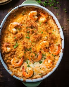 a casserole dish filled with shrimp and cheese