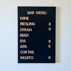 a sign on the wall that says wine, riesling, syrah, beer, tapa, appa, cocktail mojit