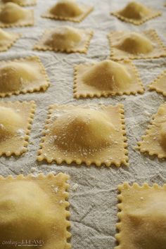 homemade ravioli on a baking sheet ready to go into the oven