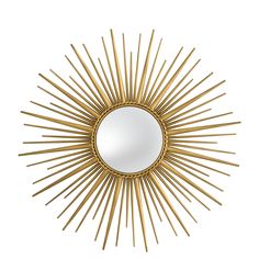 a gold sunburst mirror on a white wall