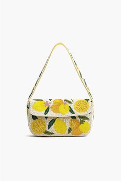 Luxe Embellished shoulder bag Beautifully hand-beaded lemons in bright and butter yellow Embellished shoulder straps Magnetic Button closure Lined interiors with zip pocket Size: 10" X 5.5" X 2" Handmade by Artisans Embrace the whimsical charm and let your style shine with the Make a Lemonade Shoulder Bag. A luxurious Summer Shoulder Bag, Handmade Shoulder Bag, Staud Bags, Beaded Shoulder Bag, Summer Handbag, Make Lemonade, Leopard Bag, Butter Yellow, Bags Luxury