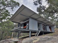 a small house built on top of a hill