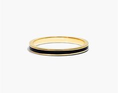 14K Yellow Gold Black Enamel Ring. It is simply impossible to deny the beauty of this ring. Wear it alone or layer it with additional bling, this ring will give the ultimate style. Elegant Stackable Enamel Ring For Anniversary, Classic Black Enamel Round Ring, Everyday Elegant Enamel Ring, Elegant Yellow Gold Enamel Stackable Rings, Elegant Gold Enamel Stackable Rings, Elegant Gold Stackable Enamel Rings, Elegant Gold Stackable Rings With Enamel, Sleek Yellow Gold Ring Jewelry, Sleek Round Band Jewelry For Formal Occasions