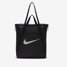 This tote bag is as multidimensional as you are. No matter what your fitness journey is, the Nike Gym Tote is made to handle it. Multiple deep pockets line the inside of this bag, both open and zippered for extra security. The front and back features pockets for the small things you want easy access to. And, the size of this tote is deceptive—the sides feature expanding fabric panels for extra space whenever you need it. Nike Tote Bags, Nike Retail, Sac Tote Bag, Gym Club, Sport Nike, Gym Tote, Nike Bags, High Leg Boots, Black Tote