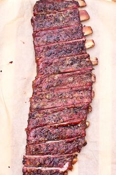 a piece of meat sitting on top of a wooden cutting board