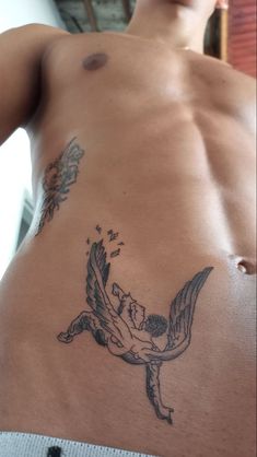 a man with a tattoo on his stomach