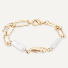 This Bracelet brings timeless elegance to the forefront with its meticulously crafted lobster clasp and gold-tone plating. Each pearl is selected for its lustrous beauty, creating a piece that exudes sophistication. Perfect for adding a touch of grace to both day and evening wear. Gold-Tone Plated Nickel, Lead, and Cadmium Free Product Code: DB2164K Collection: Audrey Type: Clasp Material: Base Alloy & Faux Pearls Dimensions: Length 18-21cm Pendant Dimensions: Style: Classic Includes: Metal Charm Bracelet With Pearl Chain, Elegant Metal Bracelets With Lobster Clasp, Elegant Metal Bracelet With Lobster Clasp, Elegant Metal Bracelets With Gold Clasp, Elegant Metal Bracelet With Gold Clasp, Elegant Metal Charm Bracelet With Extender, Elegant Gold Metal Bracelet With Lobster Clasp, Elegant Gold Plated Paperclip Bracelet With Lobster Clasp, Elegant Gold Paperclip Bracelet With Lobster Clasp