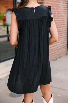 This black ruffled babydoll dress, with its ruffled cap sleeves and smocked neckline, is just the easy, breezy style you've been looking for! The fun ruffled detail adds a playful twist, while the babydoll fit keeps it laid-back and versatile. Perfect for a casual day out or a relaxed evening gathering, this dress is about to become your wardrobe's MVP. 
Round smocked neckline
Button keyhole back
Ruffled cap sleeves
Babydoll cut
No stretch
Sydney is wearing the small. Longing For Love, Black Ruffled Dress, Breezy Style, Mint Julep Boutique, Ruffled Dress, Love Black, Short Dresses Casual, Easy Breezy, Model Fits