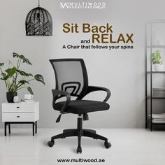 a black office chair sitting in front of a white wall with the words sit back and relax